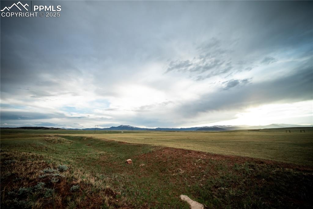 Image 9 of 10: View of yard with a rural view and a mountain view