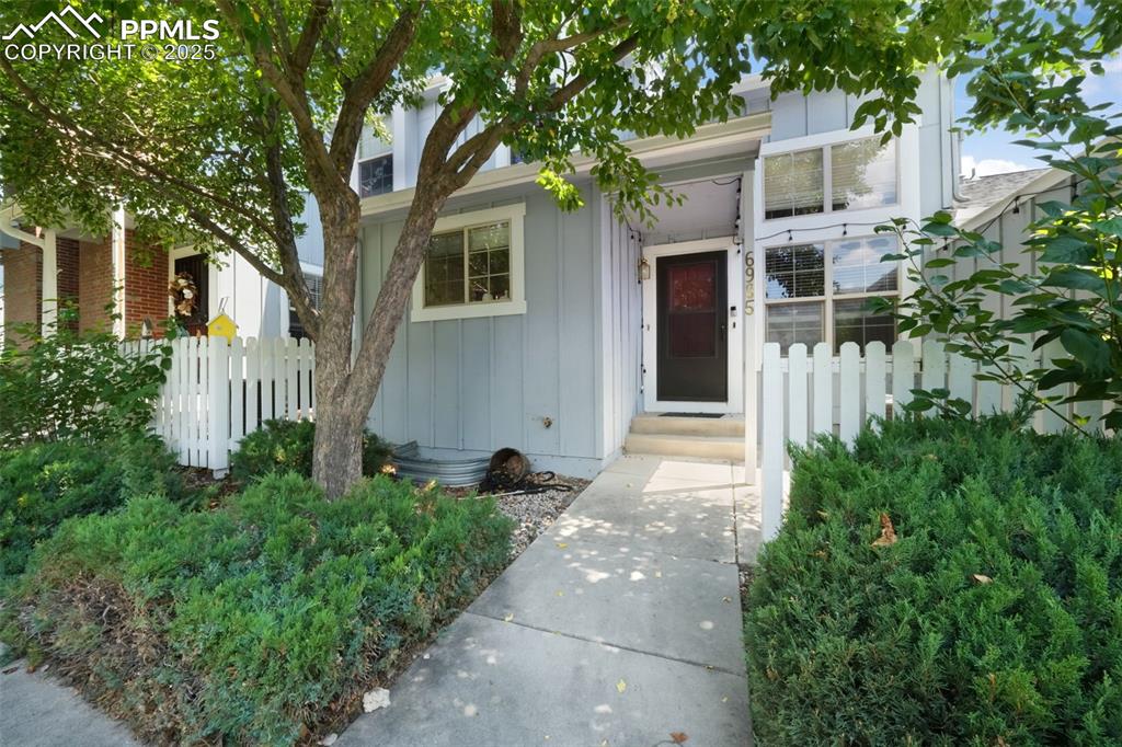 Caption: View of front facade with board and batten siding