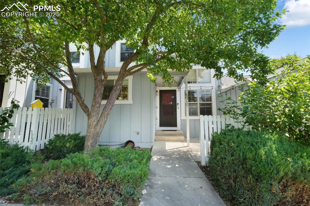 Image 2 of 47: View of front of house with board and batten siding