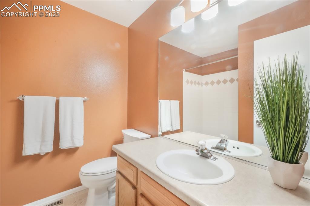 Image 32 of 47: Bathroom with vanity and a shower