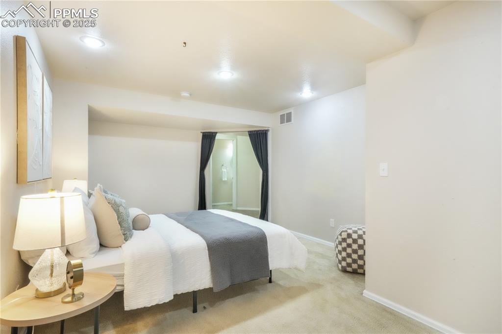 Image 36 of 47: Carpeted bedroom with baseboards