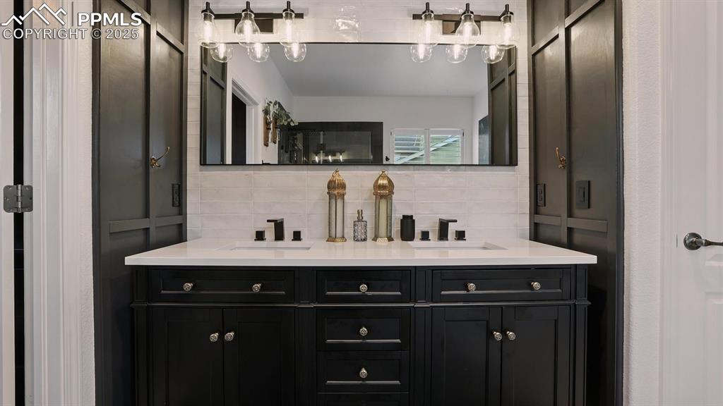 Image 22 of 50: Dual sink vanity and mirror in the Primary Bathroom.