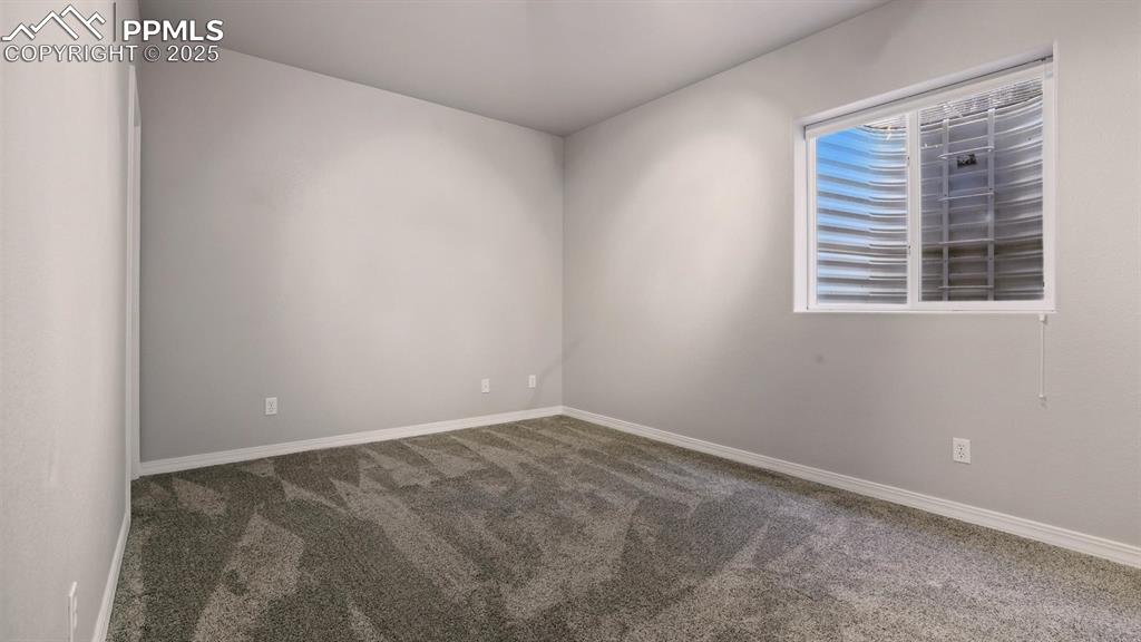 Image 45 of 50: Basement Bedroom #5 with neutral carpet.