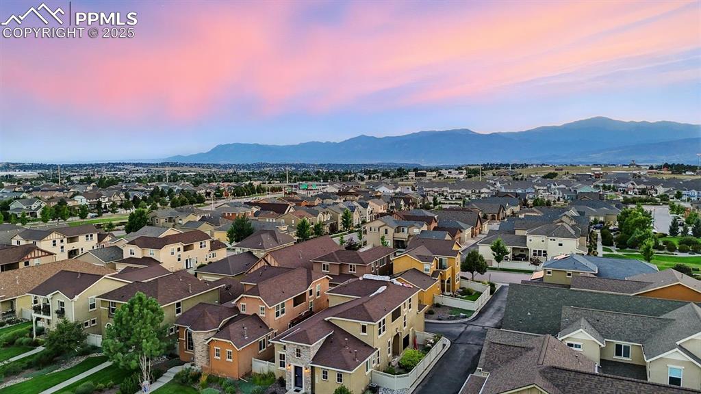 Image 47 of 50: Aerial view of home, neighborhood, and mountain views.
