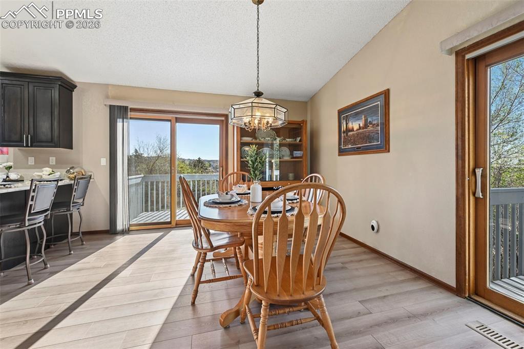 Image 12 of 45: Dining room with walk-out.