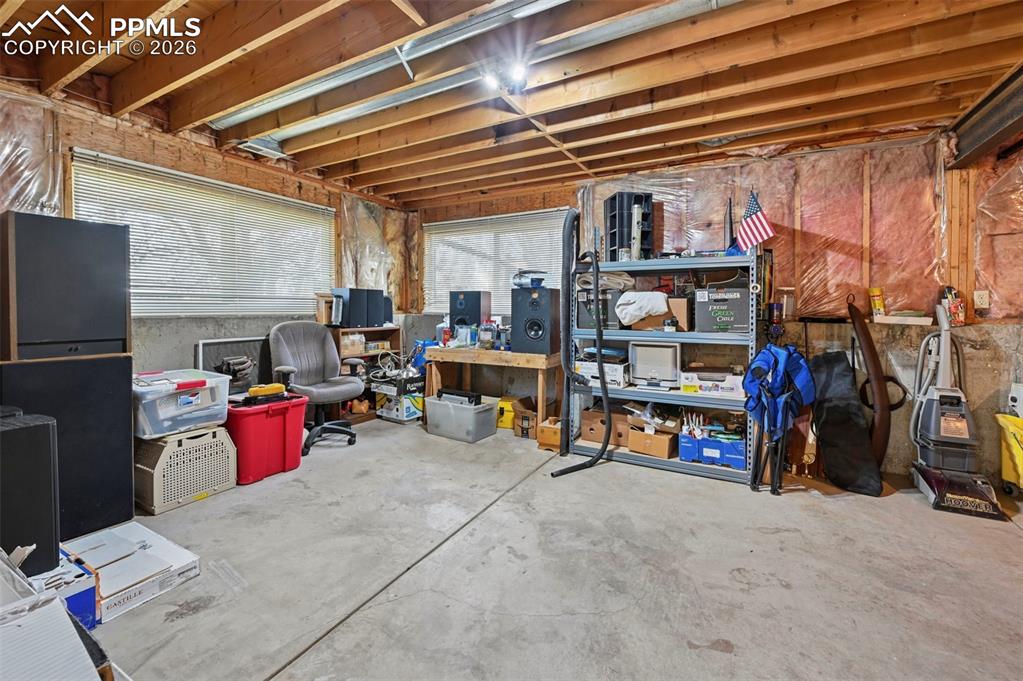 Image 29 of 45: Large unfinished space in basement.