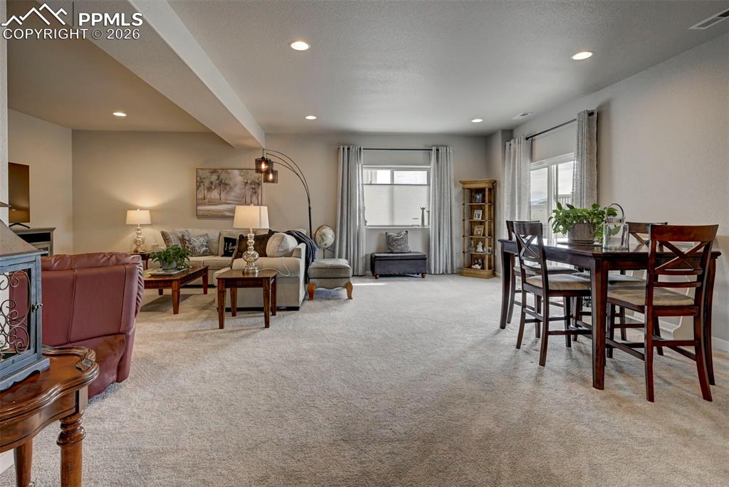 Image 32 of 41: Living room featuring light carpet and recessed lighting