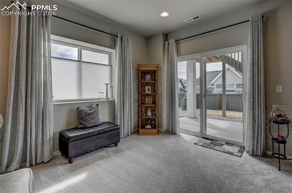 Image 33 of 41: Sitting room with carpet flooring and recessed lighting