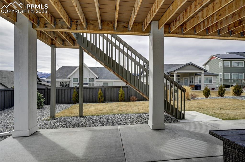 Image 39 of 41: View of patio with a residential view and stairs