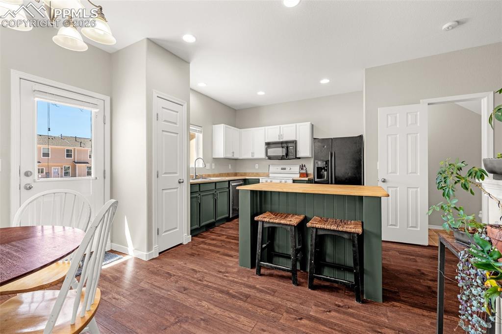 Image 12 of 32: Kitchen with a walk out to the back yard area.