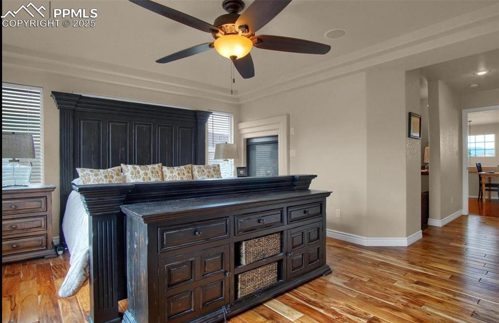 Image 23 of 42: Bedroom with baseboards and light wood finished floors
