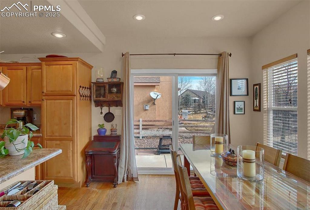 Image 7 of 42: Dining space featuring light wood-type flooring, recessed lighting, and a h