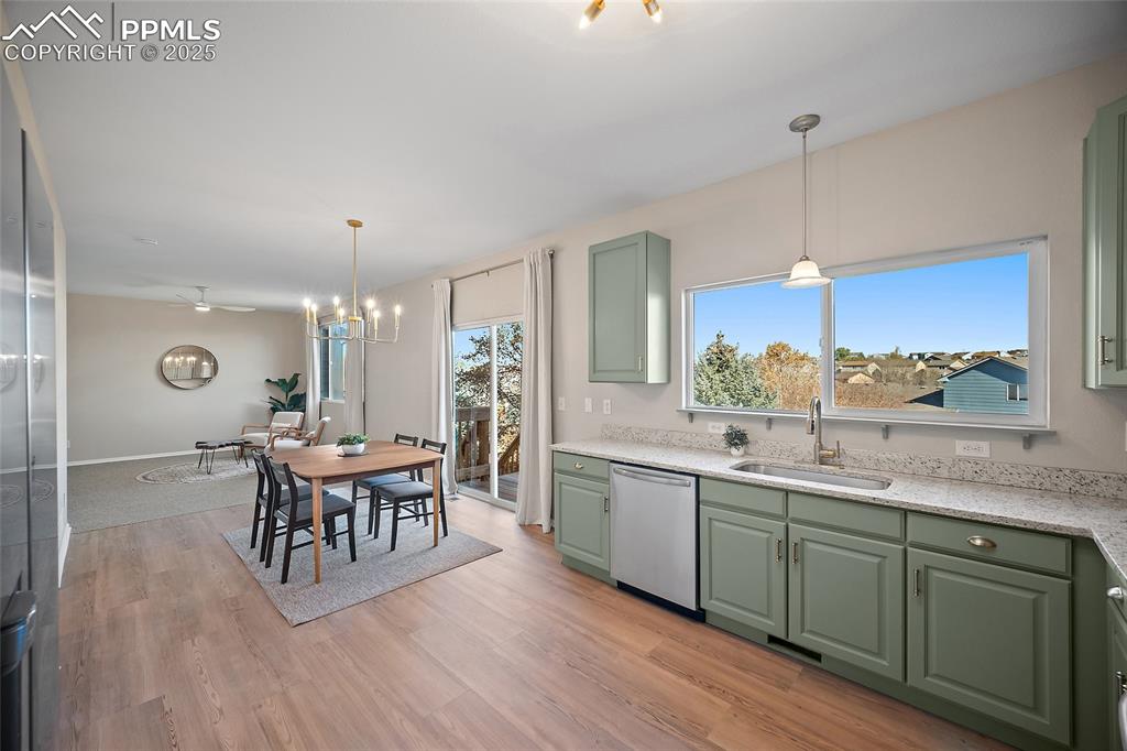 Image 12 of 45: View from kitchen through dining area to living room