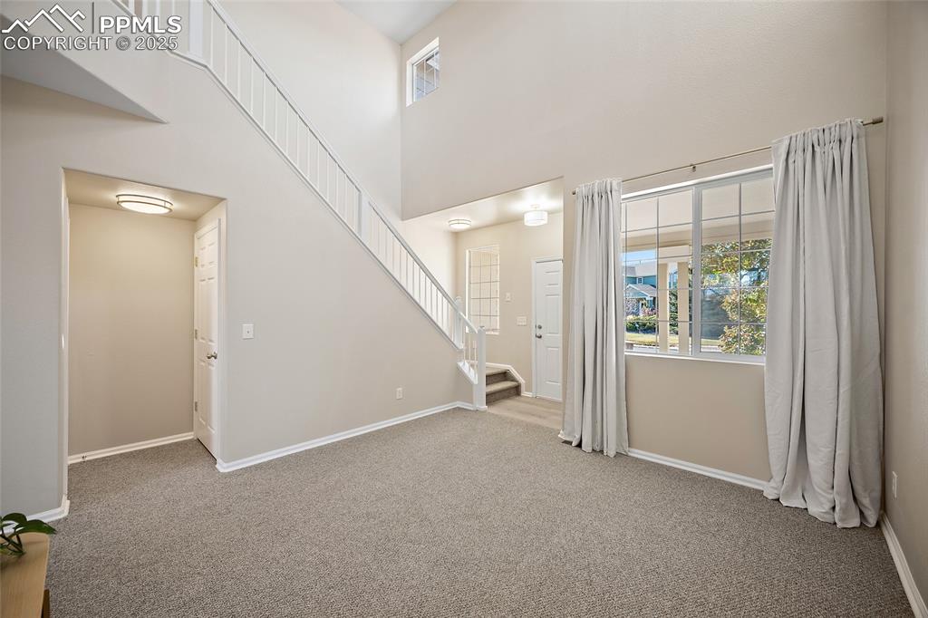 Image 14 of 45: View of entry to guest bath and upstairs living