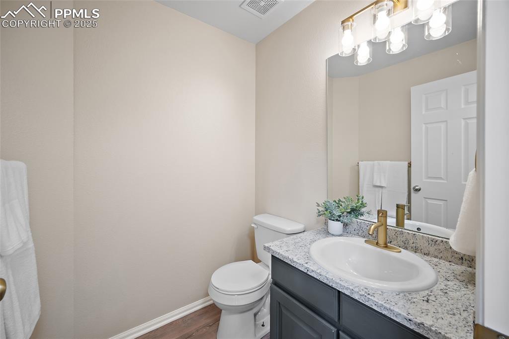 Image 15 of 45: Guest bathroom with new granite counter tops on main level
