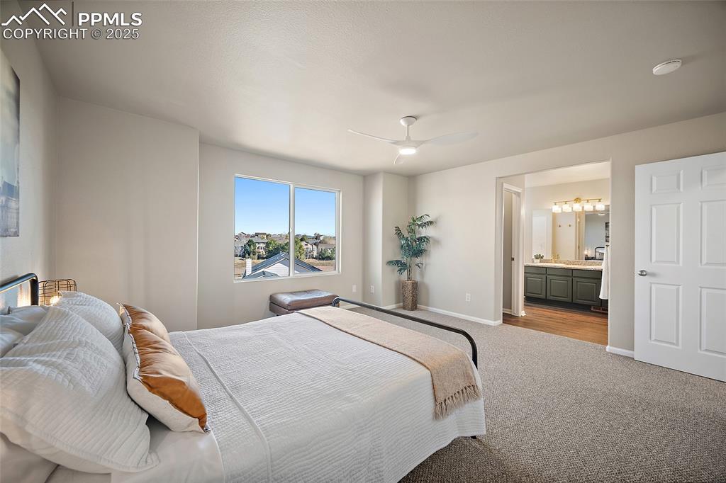 Image 18 of 45: Primary bedroom suite leading to primary bath