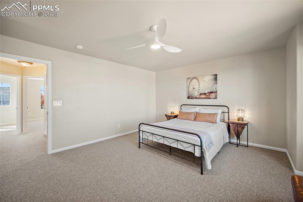 Image 22 of 45: Primary bedroom leading to guest bath and alternate bedrooms