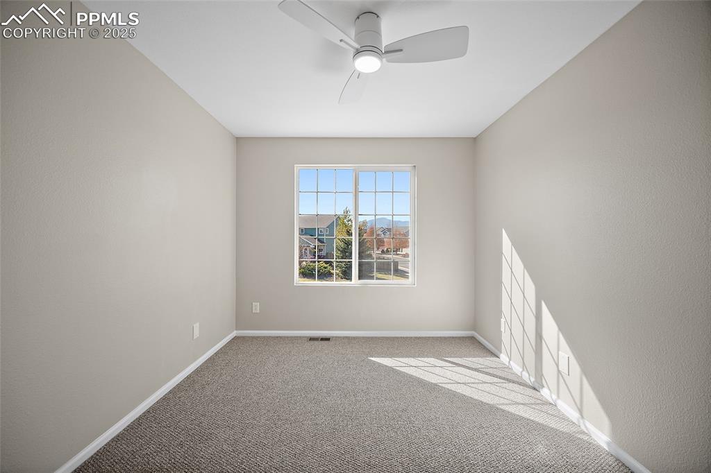Image 26 of 45: Second guest bedroom with view of the mountains