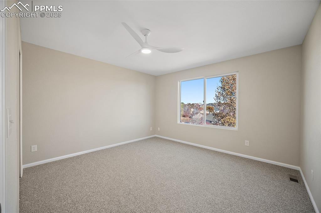 Image 28 of 45: Third guest bedroom with amazing natural light