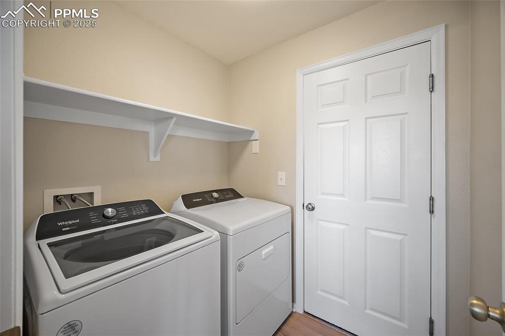 Image 30 of 45: Laundry room with newer washer and dryer (2 years) with entry points from k
