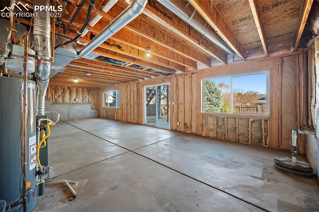 Image 32 of 45: Unfinished basement with windows and walkout. Amazing amount of natural lig
