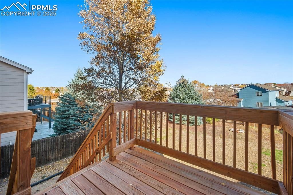 Image 34 of 45: Deck off of sliding glass doors from kitchen