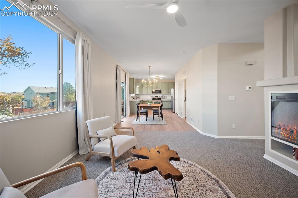 Image 7 of 45: View from living room to dining area to open concept kitchen