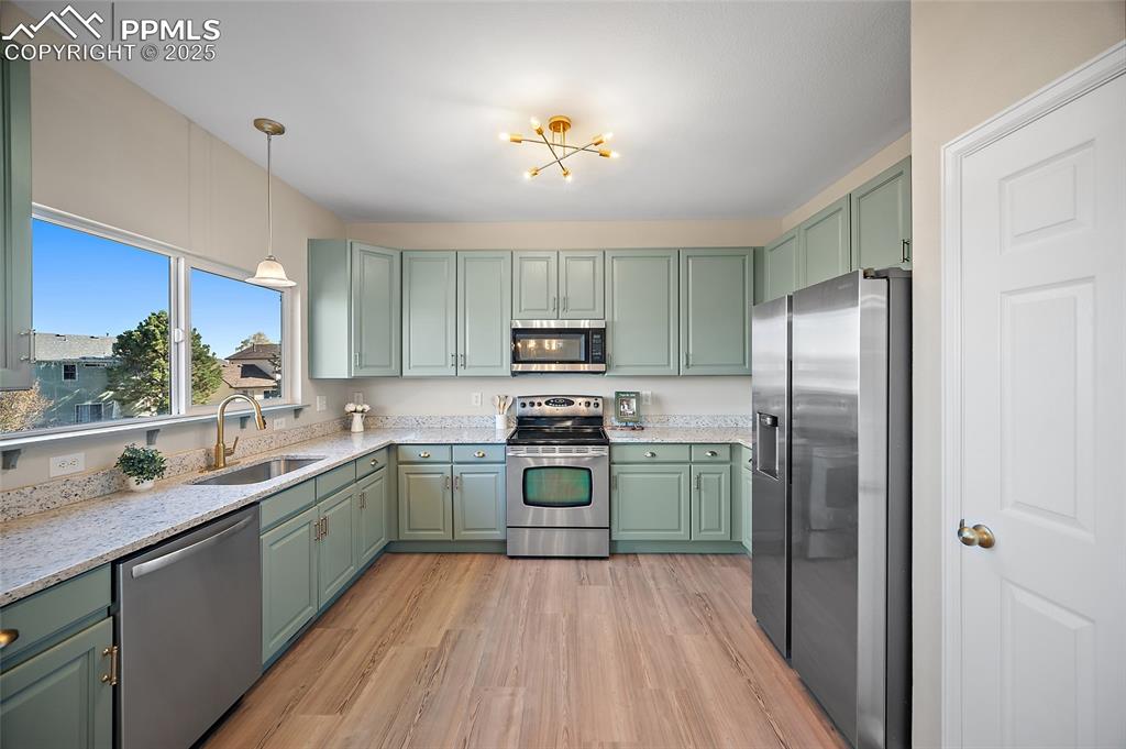 Image 9 of 45: Kitchen filled with natural light, new granite counter tops, abundant cabin