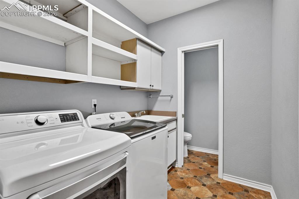 Image 10 of 49: Laundry/Mud Room -  off the kitchen and door into garage