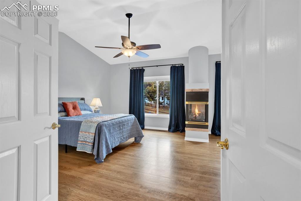 Image 16 of 49: 3 sided fireplace