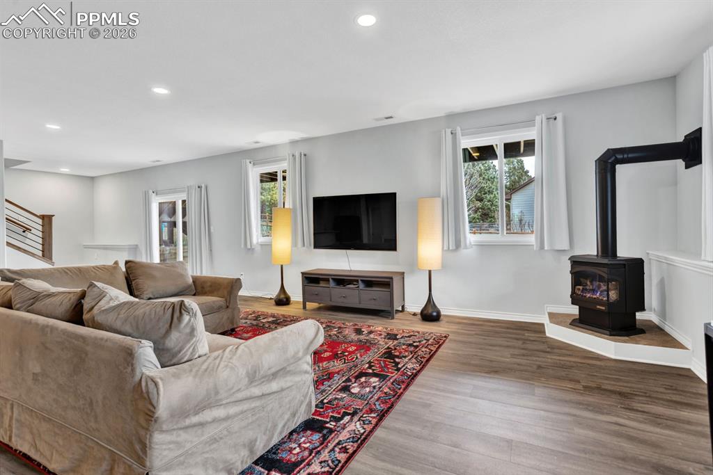 Image 31 of 49: Recreation area with gas stove-heats up the area on those snowy days