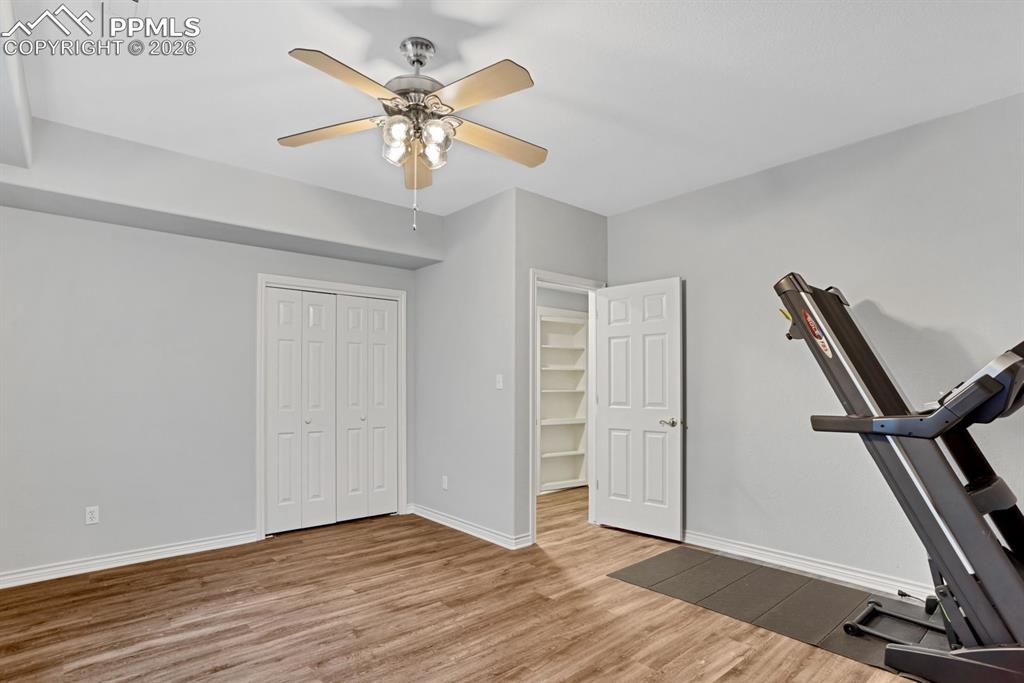 Image 38 of 49: Basement Bedroom 5 was used as a workout space - TV and Treadmill stay