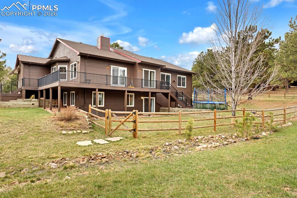 Image 42 of 49: With walk-out basement and Trampoline stays 