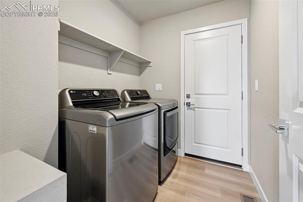 Image 24 of 42: Convenient laundry on main 