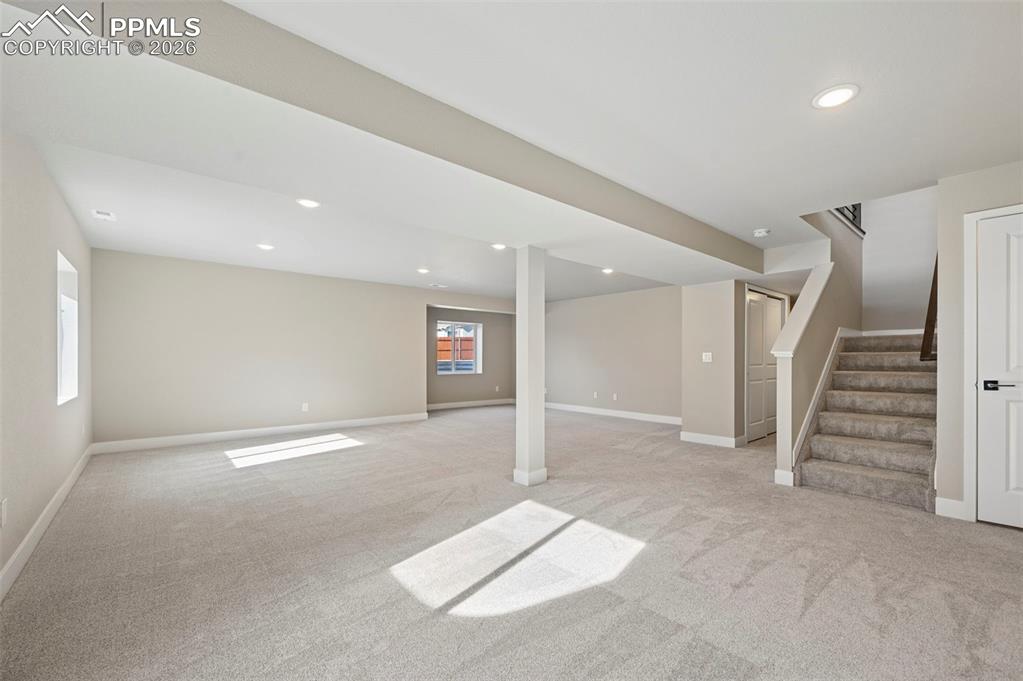 Image 26 of 42: Unstaged fully finished basement with 2 additional bedrooms and 1 full bath