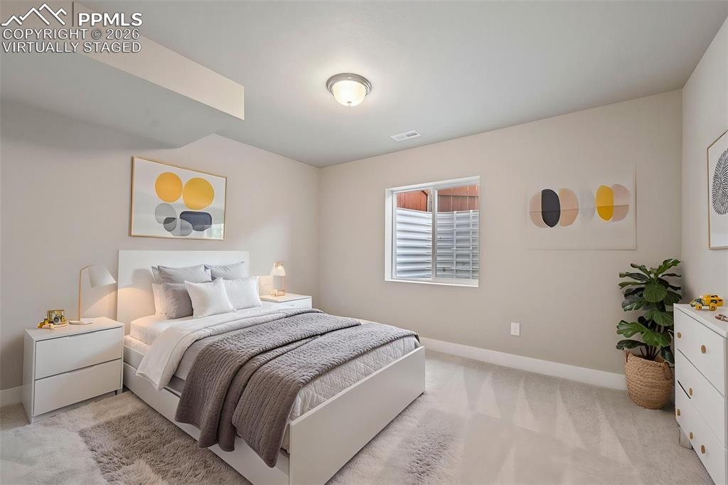 Image 30 of 42: Virtually staged bedroom in basement 