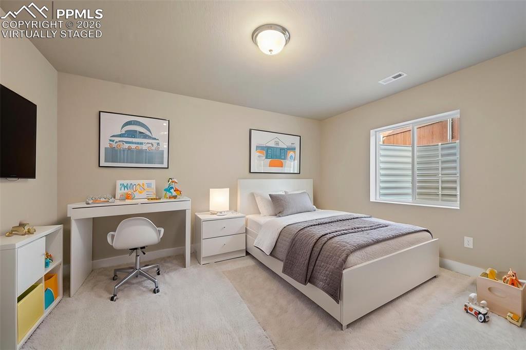 Image 32 of 42: Virtually staged bedroom in basement 