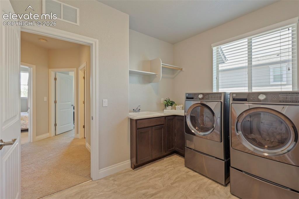 Image 26 of 38: Washer & dryer are included with purchase