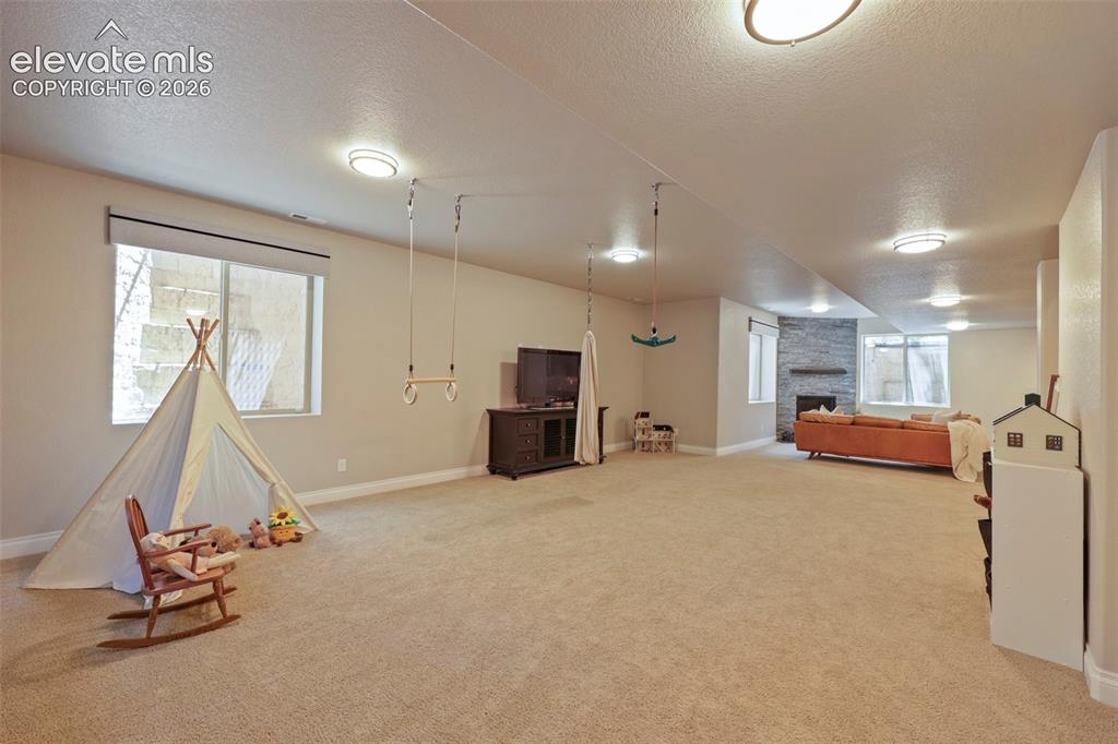 Image 29 of 38: Large area for kiddos to play or perfect game room