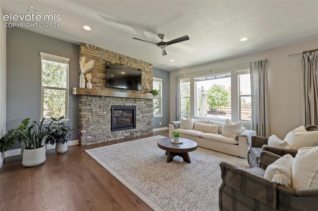 Image 5 of 38: Gas fireplace & bathed in sunlight