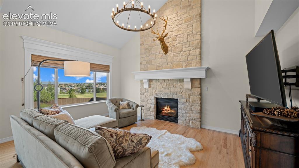 Image 10 of 30: Stunning floor to ceiling Austin Stone FP with custom mantel