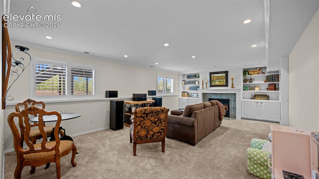 Image 22 of 30: Notice the garden level. FP and built ins.