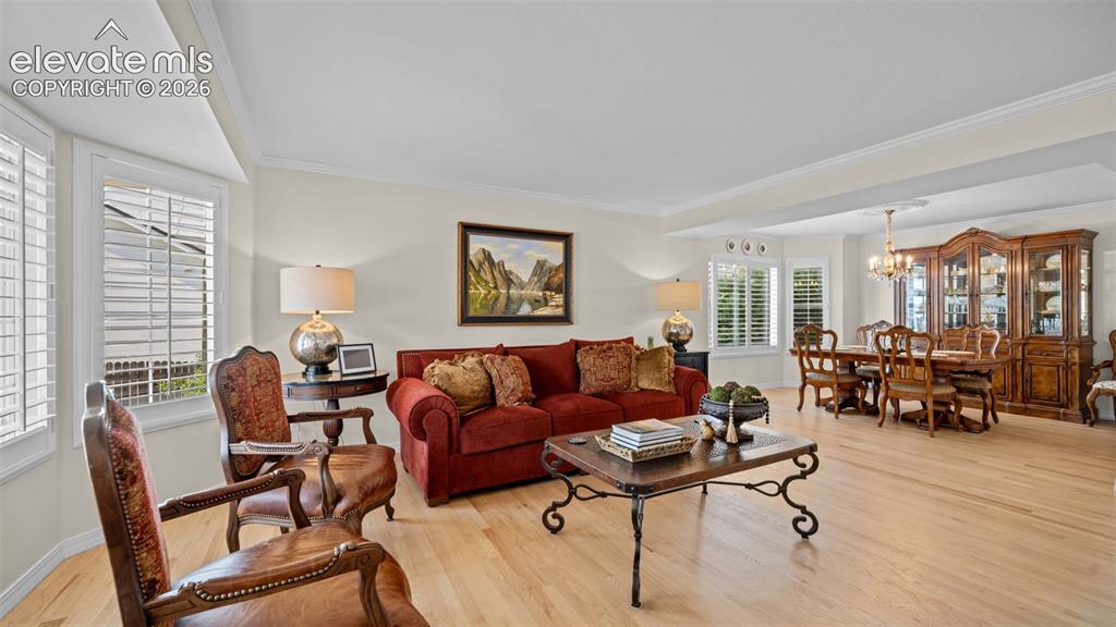 Image 3 of 30: Notice all the updates with crown molding, newer flooring and trim