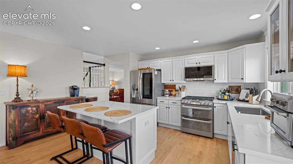 Image 9 of 30: Gas range top and double electric oven