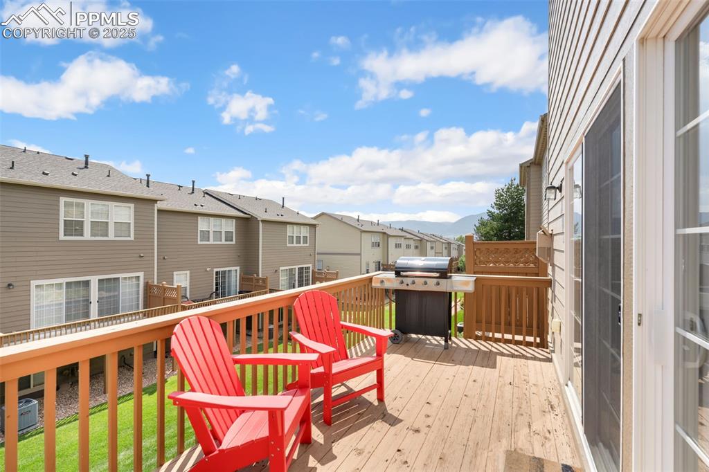 Image 32 of 35: Deck featuring a residential view and area for grilling