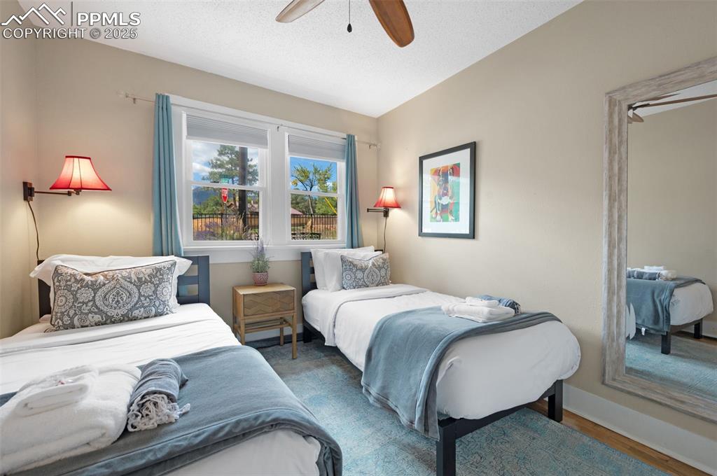 Image 17 of 42: Second bedroom with Pikes Peak view