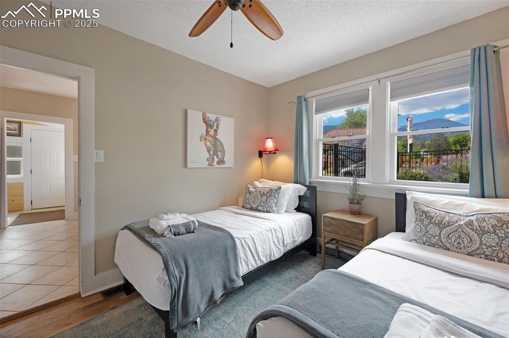 Image 18 of 42: 2nd bedroom with Pikes Peak view!