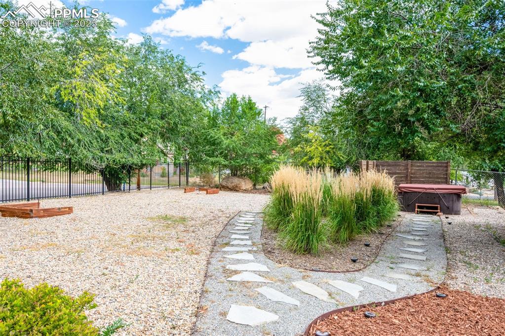 Image 25 of 42: FUN! Play horse shoes or jump in the hot tub and relax