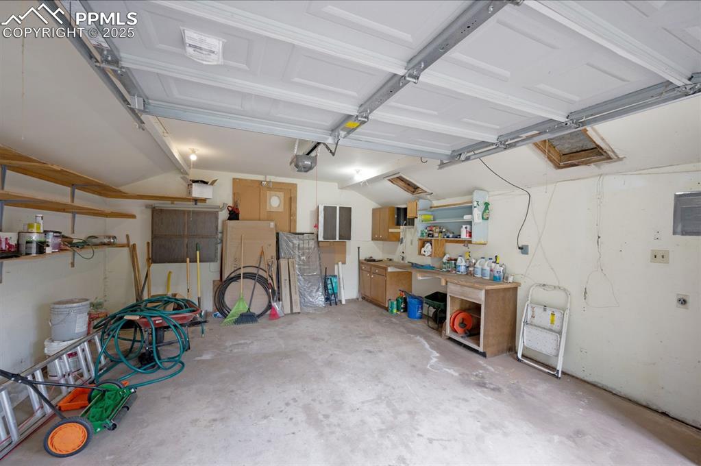 Image 34 of 42: Garage portion/ work shop area