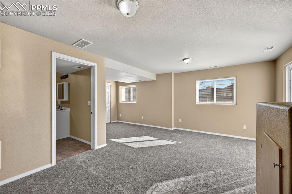 Image 25 of 29: basement bedroom/area with Income potential with a few modifications 